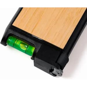 A level tool with a wooden top and black edges, featuring a small green bubble level indicator.