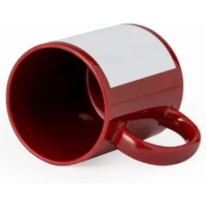 A red mug with a white space for customisation, featuring a rounded handle.