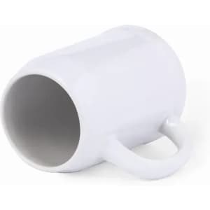 A white mug with a handle, lying on its side. The interior is also white.