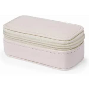 A storage box in soft pink, featuring a textured exterior and zip closure. It has a subtle stitching detail.