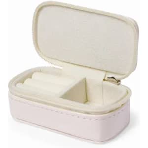 A small, soft leather jewellery case in pale pink with a zipped closure and plush interior.