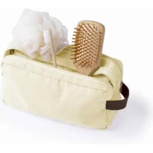 A yellow toiletry bag containing a wooden hairbrush, a loofah, and a toothbrush. Features a zip closure and handle.