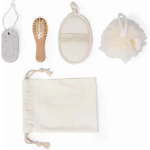 A bath set featuring a loofah, brush, pumice stone, exfoliating mitt, and cotton bag, all in neutral colours.