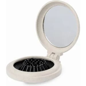 A compact mirror with a round design, featuring a reflective surface and storage for small items inside. It has a white colour.