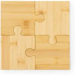 A bamboo puzzle piece in natural tones, featuring interlocking sections. The surface is smooth and lightly textured.