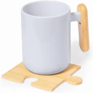 A white ceramic mug with a wooden handle, sitting on a wooden puzzle piece coaster.
