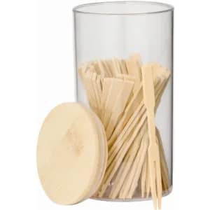 A clear container filled with wooden skewers, topped with a wooden lid. The skewers are arranged neatly inside.