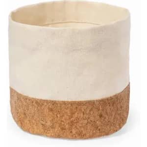 A storage basket featuring a natural cork base and a cream fabric upper section, with a simple, minimalist design.