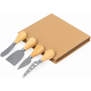 A set of four cheese knives with wooden handles displayed alongside a cardboard holder.