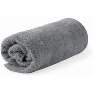 A grey rolled towel made of soft, fluffy material, showcasing a simple and elegant design.