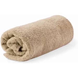 A rolled towel in a soft beige colour, showcasing a plush, textured fabric.