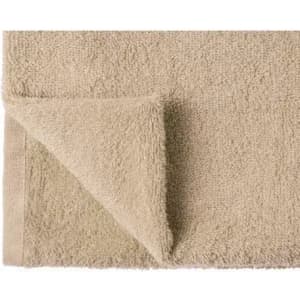 A beige towel with a folded corner, featuring a textured, plush surface. It has a simple, clean design.