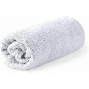 A rolled grey towel made of soft fabric, showcasing a plush texture.