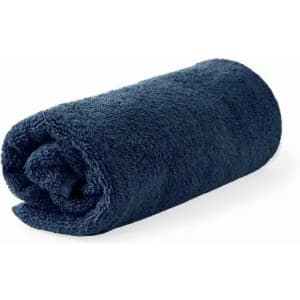 A rolled navy blue towel with a soft, textured appearance. It has a simple design and is fluffy.