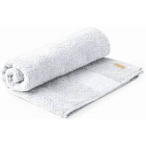A grey, rolled towel with a textured surface and a small logo on the side.