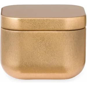 A gold decorative container with a smooth, rounded shape and a flat lid. The surface has a shimmering finish.