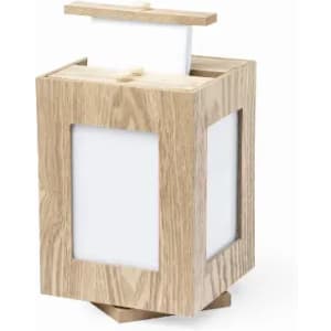 A wooden lantern with a square design, featuring white panels and a top section for holding paper.