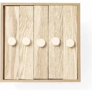 A wooden box with five slatted panels in light wood, each featuring a round, cream-coloured knob.