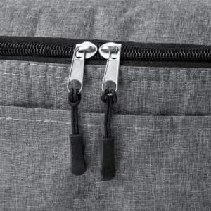 A grey zipped bag with dual metal zippers and black pull tabs. The fabric features a textured finish.