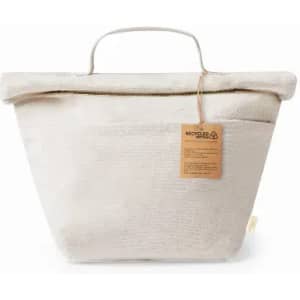 A storage bag in a light cream colour with a handle and label made from recycled materials.