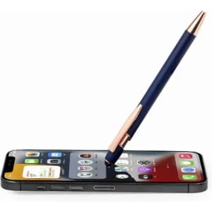 A smartphone with a blue and rose gold pen resting on its screen, displaying various app icons.