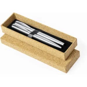 A pen set in silver colour, presented in a kraft-style box with a black lining. The box is open, revealing the contents.