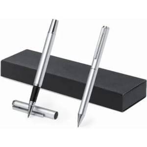 A set of silver pens displayed beside a sleek black box. The pens feature a logo and include a ballpoint and rollerball pen.