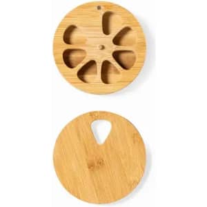 A round bamboo product with cut-out designs on one side and a plain surface on the other side.