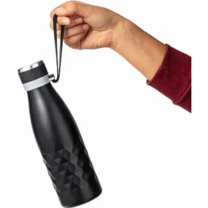 A drink bottle in matte black with a diamond-shaped pattern, held by a hand with a strap attached.
