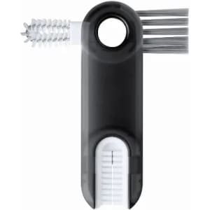 A cleaning tool featuring a black handle with a bristle brush and a spiral brush attachment.