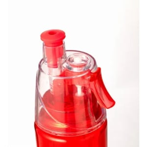 A drink bottle with a transparent body and a red nozzle. It features a push button for easy dispensing.