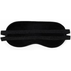 A sleep mask in black with two elastic straps for a secure fit. Simple design and soft material.