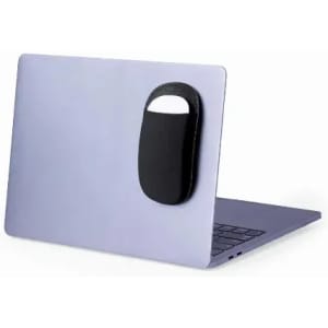 A black promotional product attached to a sleek laptop, showcasing a minimalist design.