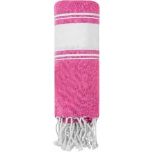 A pink towel rolled up with white stripes and tassels at the ends. It features a smooth texture.
