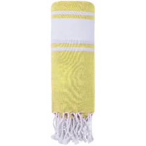 A yellow and white drawstring bag with tassels and a logo on the front.
