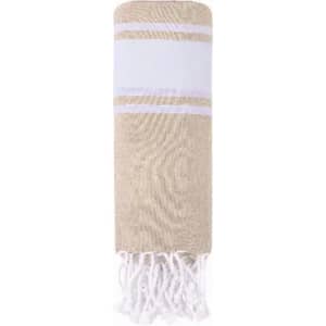 A towel featuring a beige and white striped design with tassels at one end. It has a soft texture and a simple aesthetic.