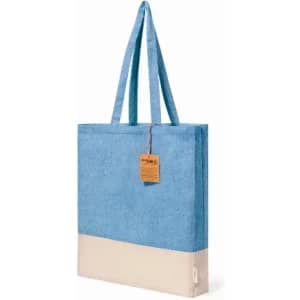 A tote bag featuring a blue upper section and a beige bottom, with two shoulder straps and a tag.