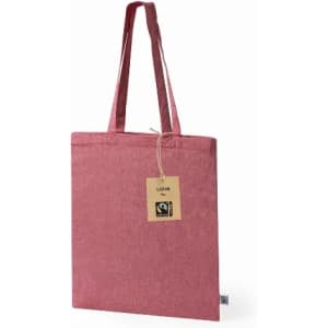 A pink tote bag with two handles, featuring a tag and a logo. The bag has a simple, solid design.