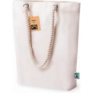 A tote bag in light cream with rope handles and a tag, featuring a logo on the side.