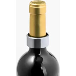 A drink bottle in black glass with a gold and silver cap, featuring a metallic ring around the neck.