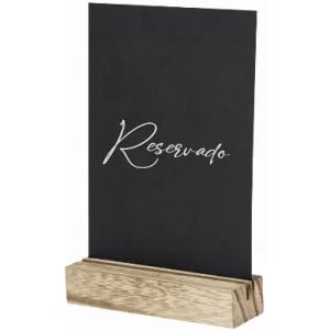 A reserved sign featuring black cardstock with white script, resting in a wooden stand.