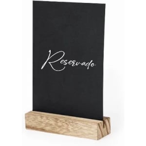 A table sign holder with a black card displaying the word "Reservado" and a wooden base.