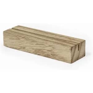 A wooden block with a smooth finish and visible grain pattern. The block is rectangular and light brown in colour.