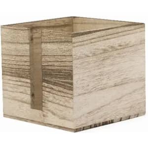 A wooden cube storage box with a light, natural finish and a textured grain pattern.
