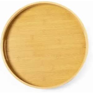 A round bamboo tray with a smooth surface and raised edges, showcasing its natural timber colour.