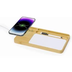 A wooden desk organiser with a mobile phone charging area, pen holder, and a space for a notepad.