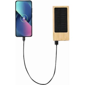 A solar charger with a bamboo design connected to a smartphone, featuring a sleek modern appearance.