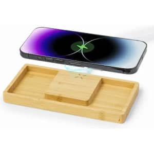 A wooden charging pad with a phone above it, showcasing a sleek design and a wireless charging feature.
