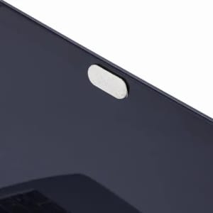 A sleek, dark-coloured protective cover with a circular closure, featuring a metallic detailing.