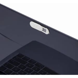A sleek, dark laptop with a silver toggle switch on the edge above the keyboard.